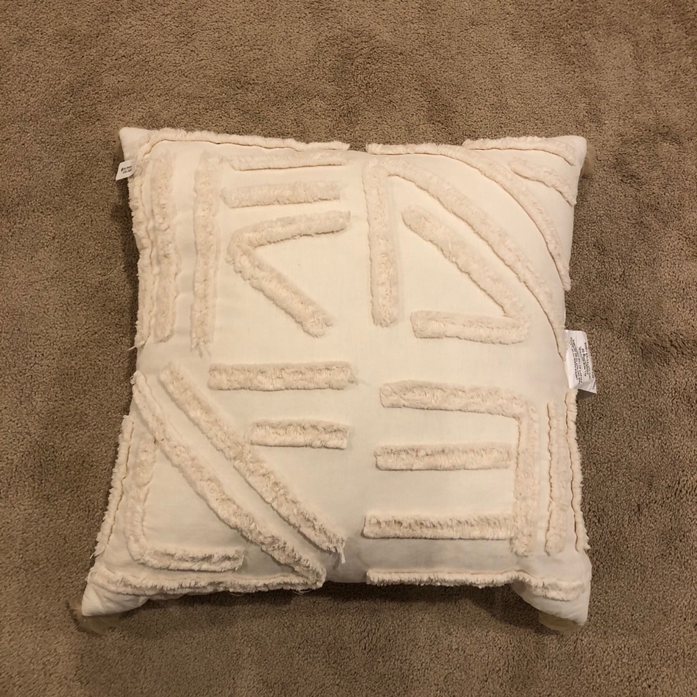 Cream decorative accent pillow